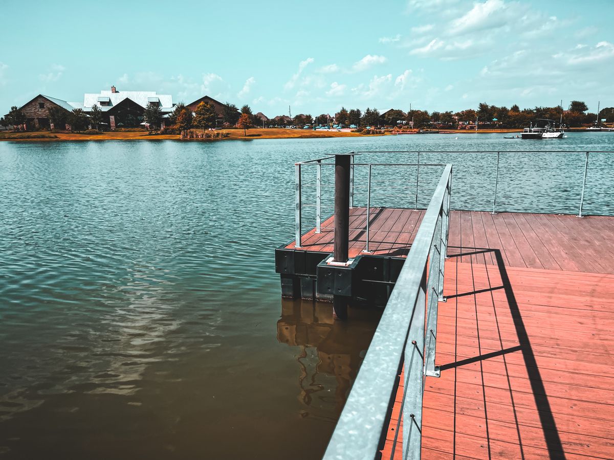 Illustrative stock photo of a lakeside pier and homes